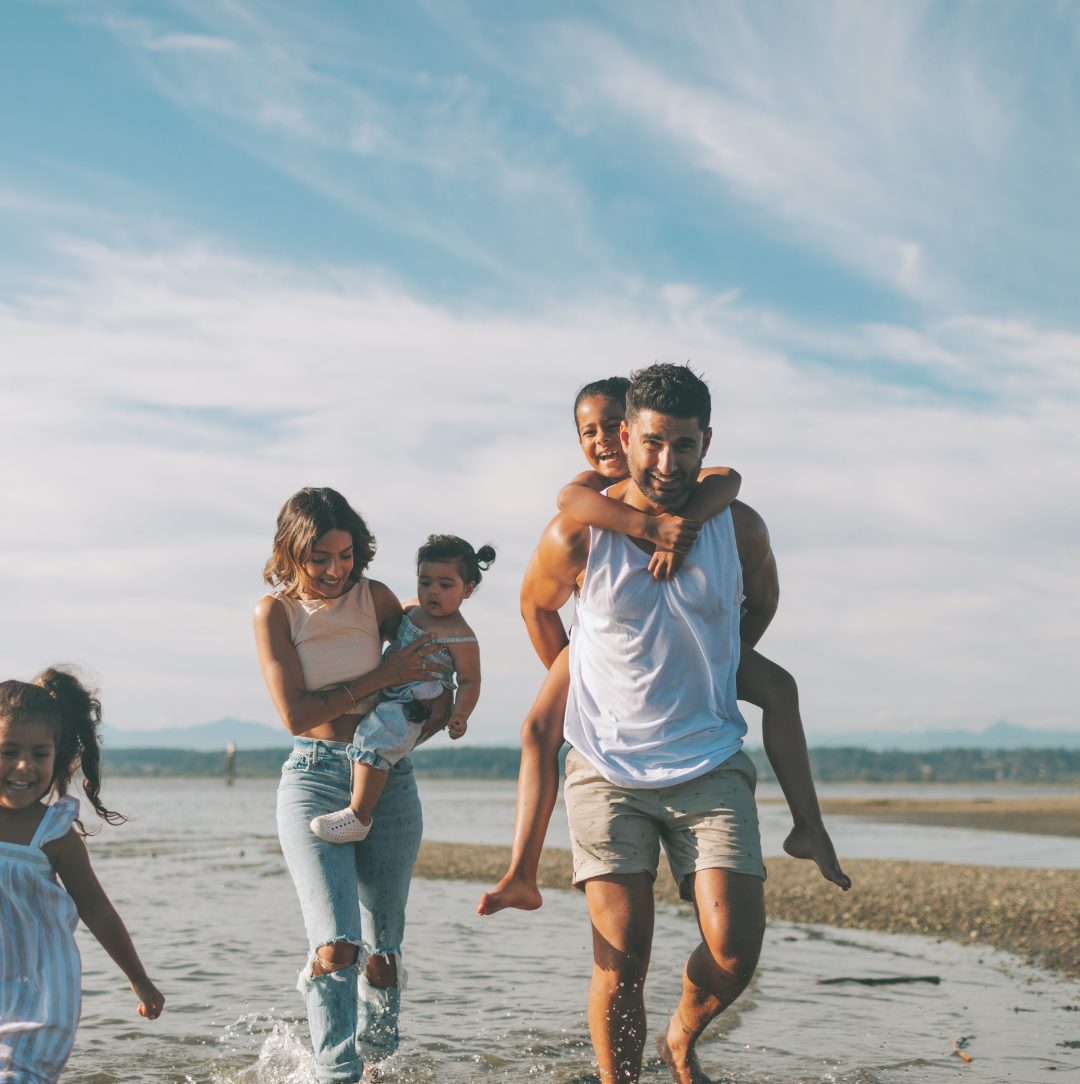 A family walking along an Australian beach
