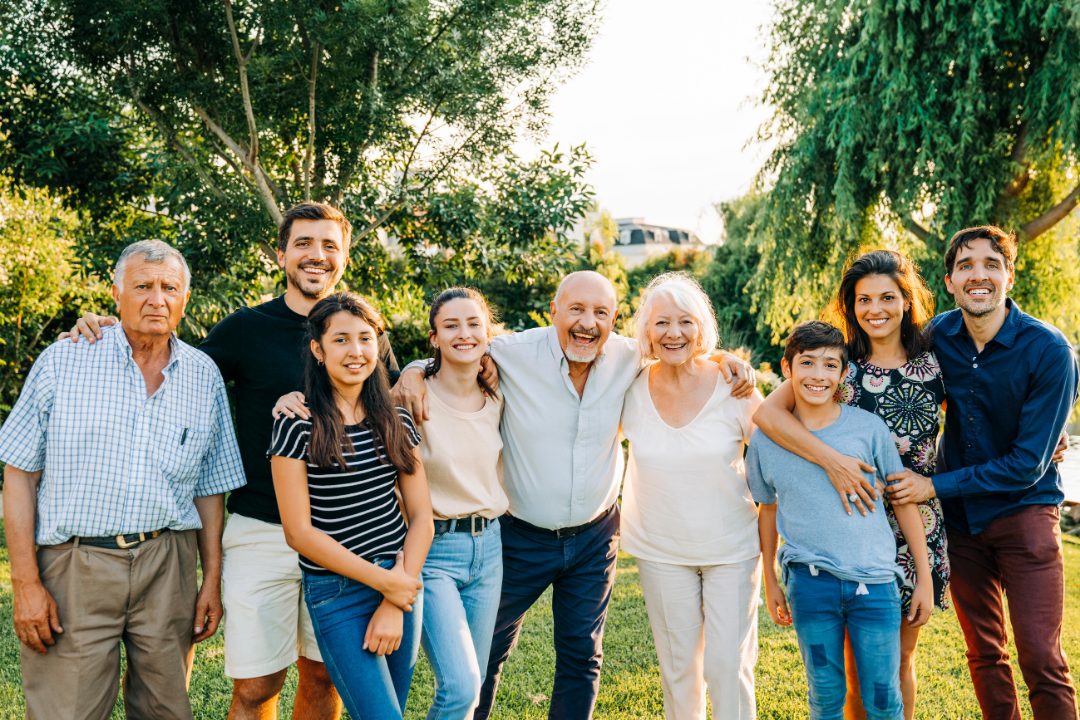 A multigenerational Australian family together outdoors