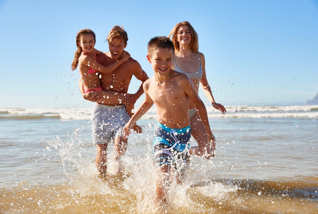 Grandparents with grandchildren at the beach